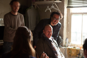 Cinematographer Emmanuel Lubezki, Michael Keaton and Director Alejandro G. Iñárritu on the set of BIRDMAN. 